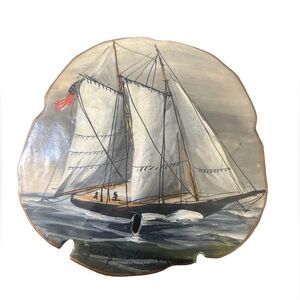 Hand painted Sand dollar with ship and ocean. Signed by artist